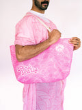 Person holding a pink patterned bag with 'Pink Party' text against a white background