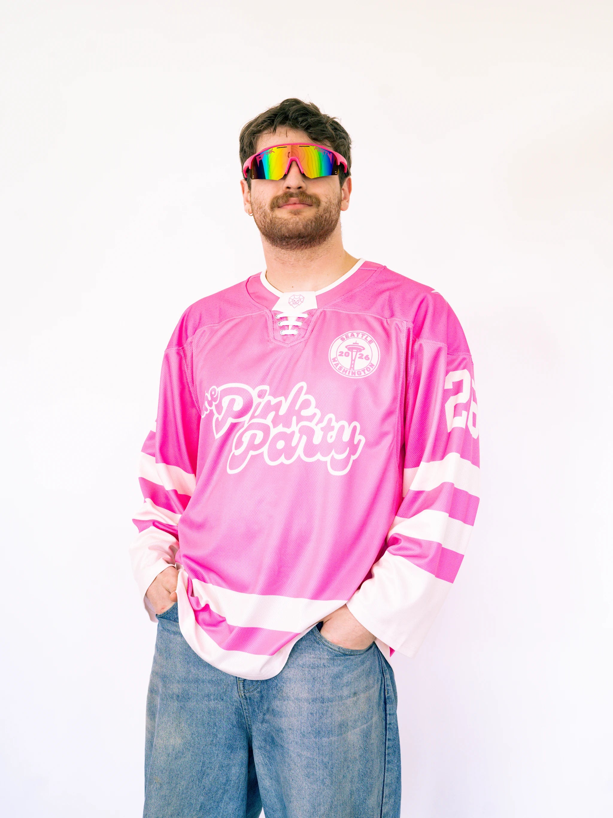 Person wearing a pink jersey with text and colorful sunglasses on a white background