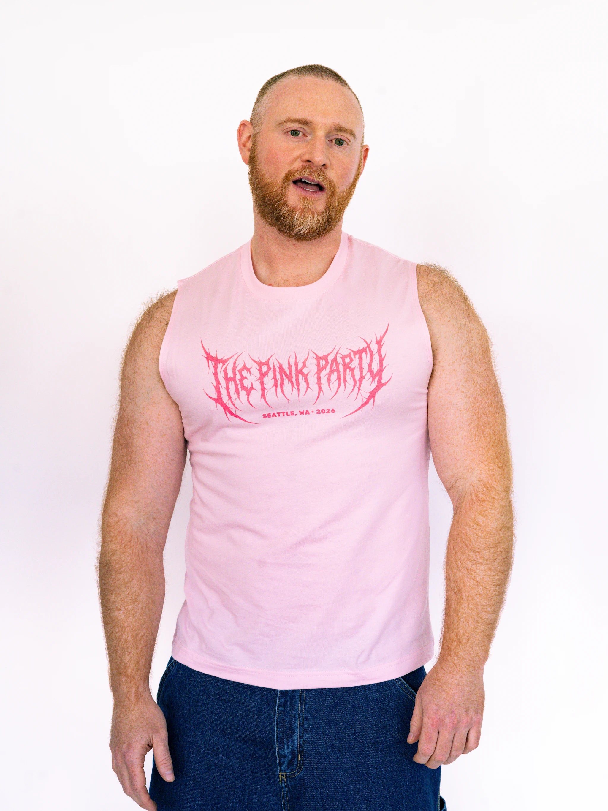 Man wearing a pink sleeveless shirt with 'The Pink Party' text on a white background