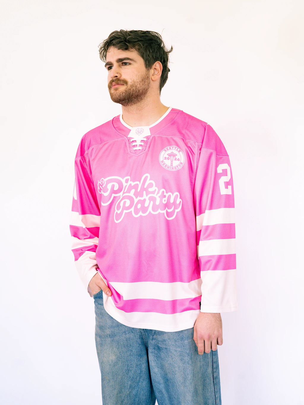 Man wearing a pink hockey jersey with 'Pink Party' text on a white background