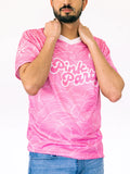 Person wearing a pink t-shirt with white text and patterns on a white background