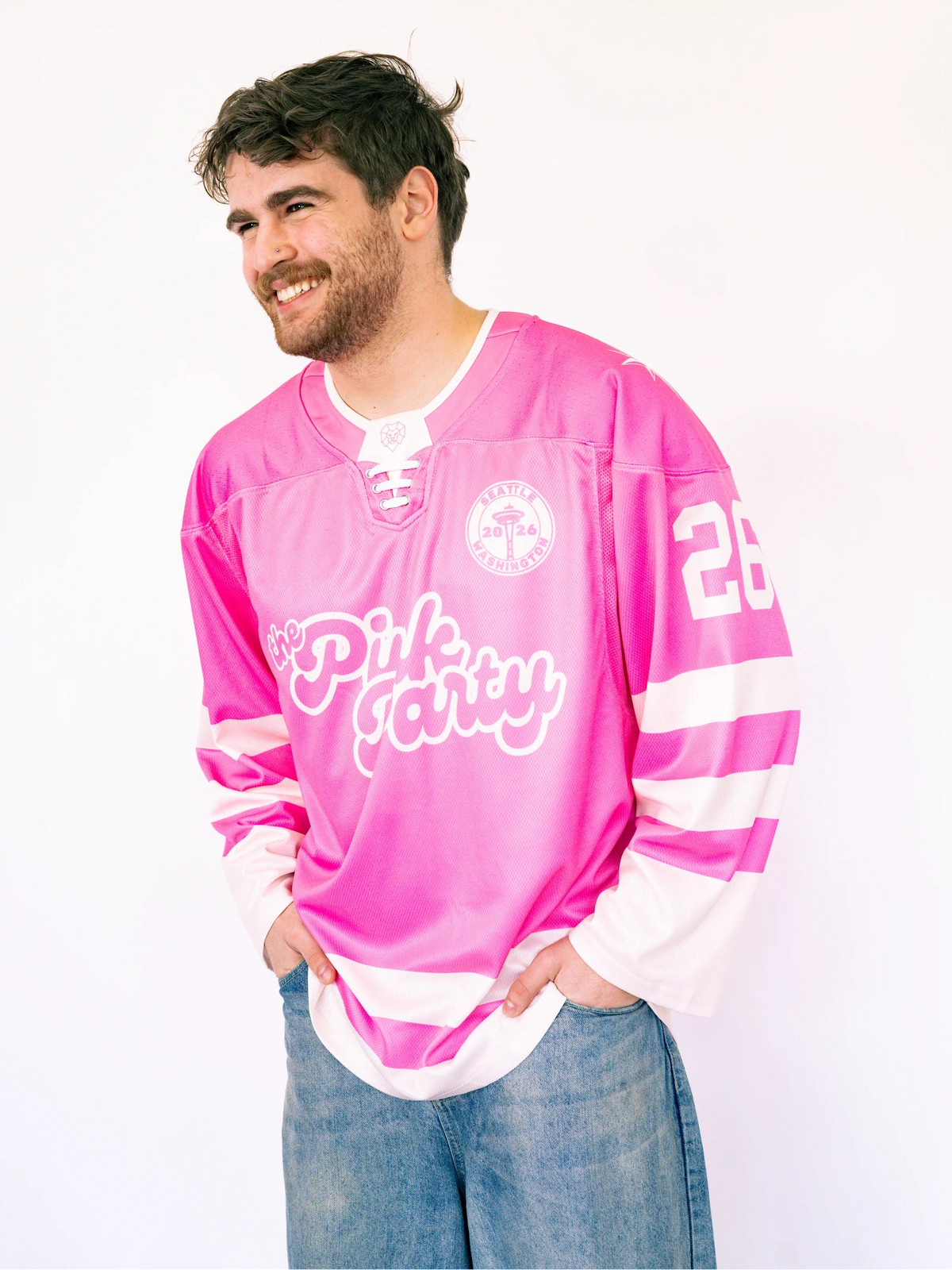 Man wearing a pink jersey with text on a white background