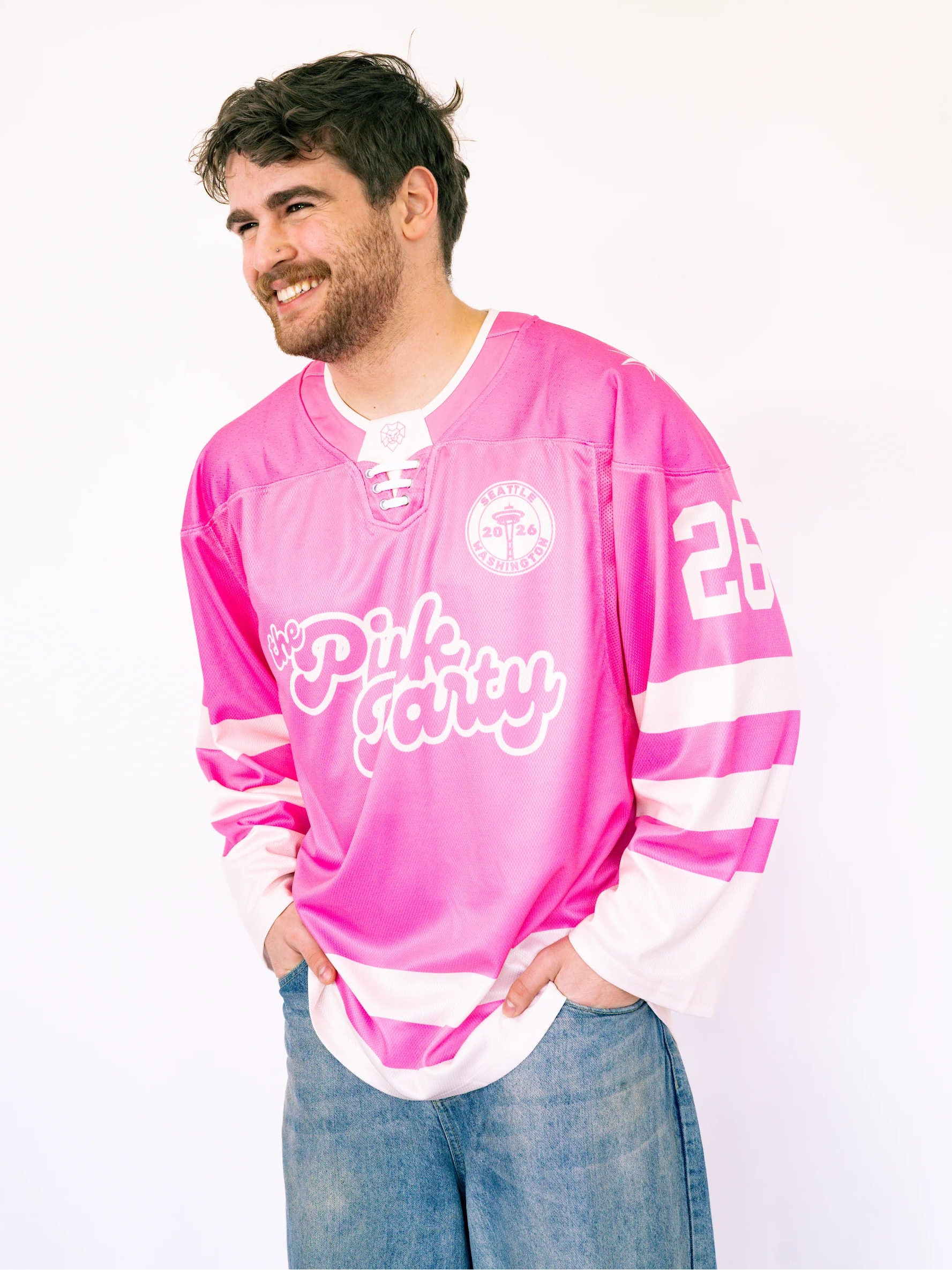 Man wearing a pink jersey with text on a white background